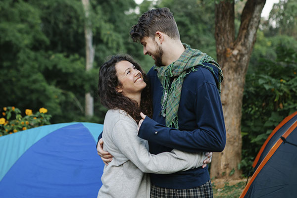 Couple camping together and feeling happier and connected after couples therapy in Castle Rock, CO.