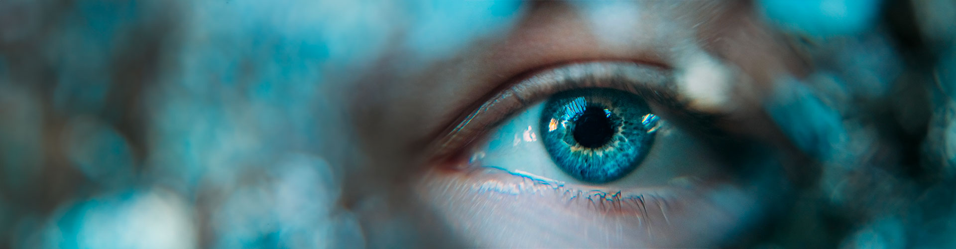 A deep blue eye close-up, representing both the visual stimulation and depth of EMDR Therapy in Castle Rock, CO.