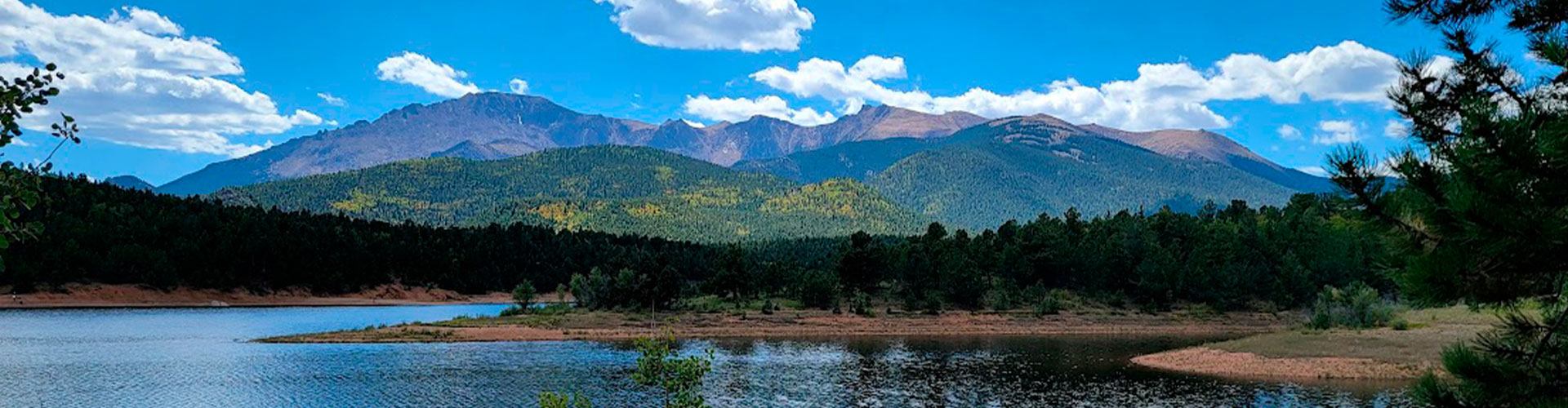 View of a lake in Colorado with the mountains in the background.