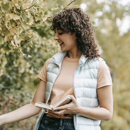 Woman feeling connected with nature while experiencing therapy outside in Castle Rock, Colorado.
