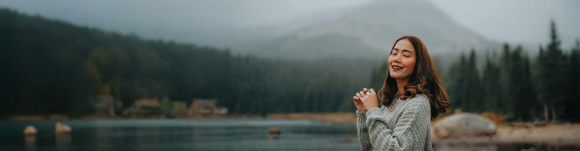 Woman in nature smiling and connected with herself after starting neurodivergence counseling in Castle Rock, Colorado.