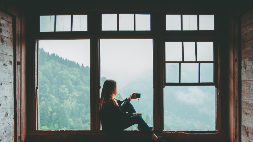 a woman enjoying a moment of peace after understanding her ADHD signs and practicing how to manage them.