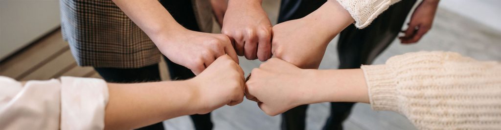 Hands together in a circle, represents our team of therapists for Authentic Connections Counseling Center in Castle Rock, Colorado.