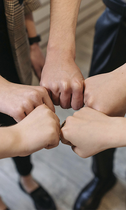 Hands together in a circle, represents our team of therapists for Authentic Connections Counseling Center in Castle Rock, Colorado.