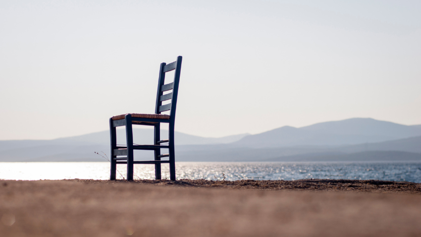 Grief beyond death - empty chair representing loss without funeral - job loss infertility divorce body grief identity loss - Castle Rock Authentic Connections Counseling Center.