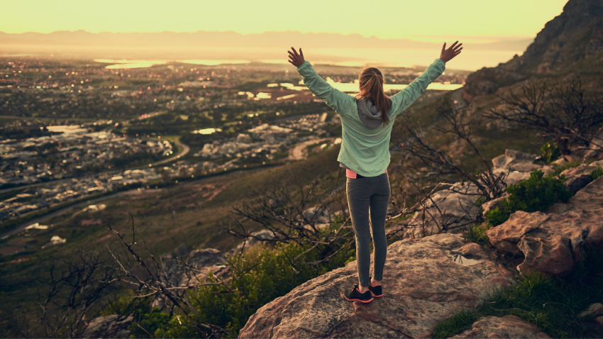 Therapy intensives one focused week of deeper healing. Similar to this person celebrating at Colorado mountain summit Castle Rock counseling.