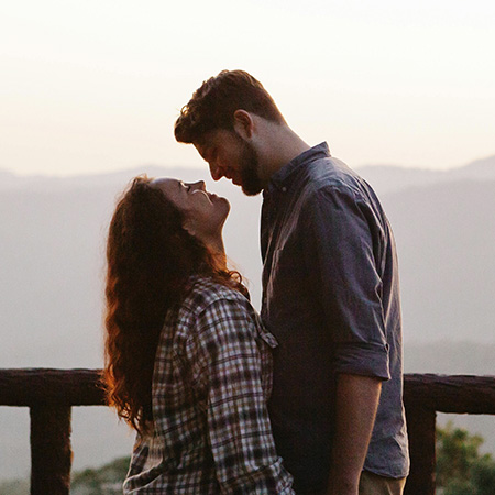 Couple in a scenic mountain view during sunset, represents our therapy intensive services for couples and individuals.